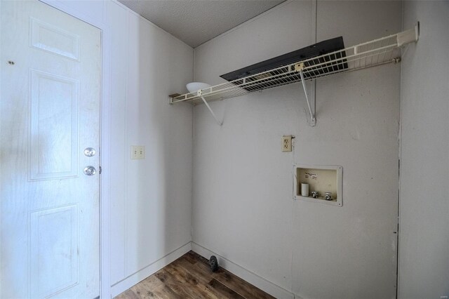 laundry area featuring washer hookup, laundry area, dark wood finished floors, and baseboards