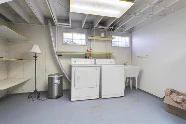 clothes washing area with laundry area and washer and clothes dryer