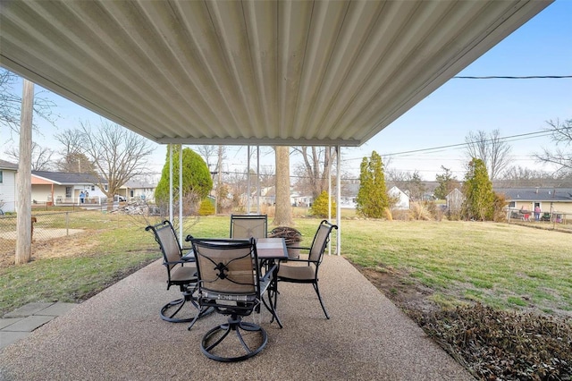 view of patio with outdoor dining space and fence