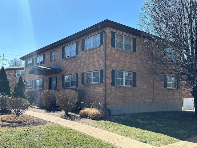 view of home's exterior with brick siding