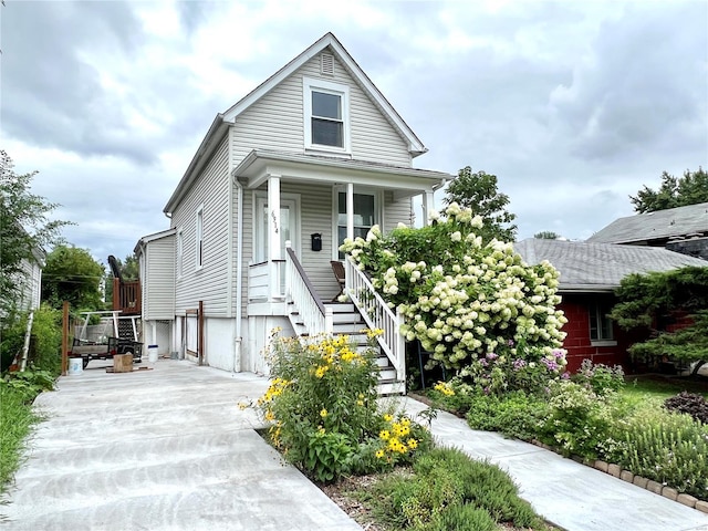 view of front facade with covered porch and stairway