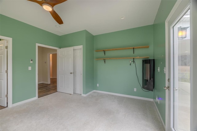 unfurnished bedroom featuring baseboards and carpet floors