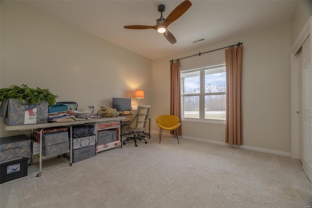 home office with baseboards, visible vents, lofted ceiling, ceiling fan, and carpet flooring