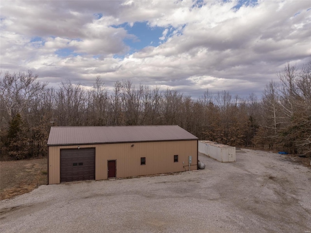 exterior space with gravel driveway