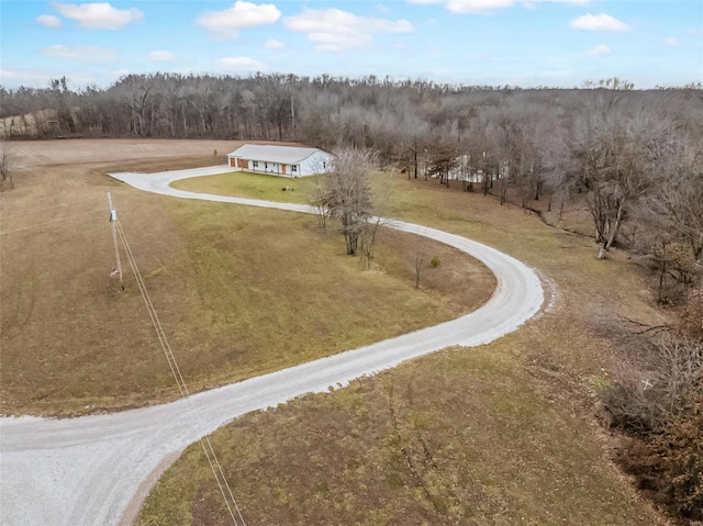 aerial view featuring a wooded view