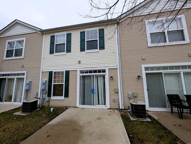 back of house featuring central AC