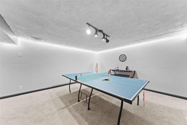 playroom with baseboards, carpet floors, a textured ceiling, and track lighting