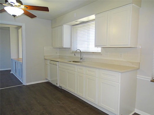 kitchen featuring backsplash, dishwasher, light countertops, and a sink