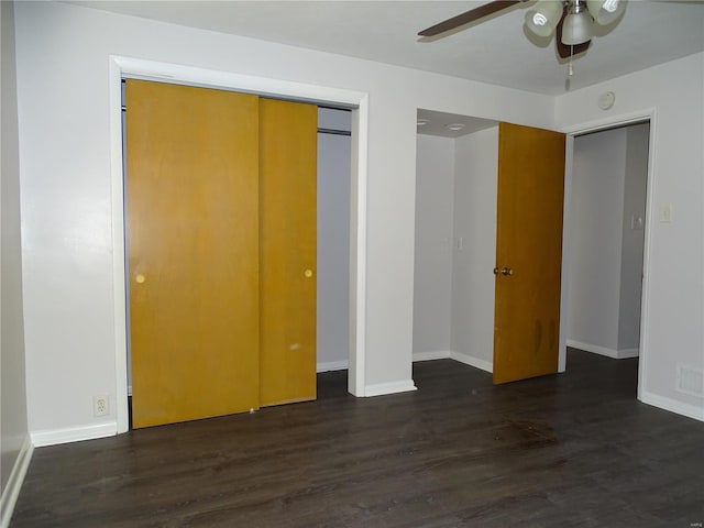 unfurnished bedroom featuring visible vents, wood finished floors, a closet, baseboards, and ceiling fan