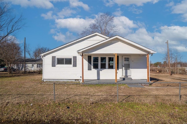 bungalow-style house featuring a front lawn, crawl space, and fence private yard