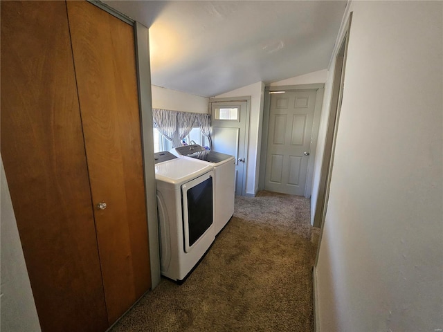 clothes washing area with laundry area, washing machine and dryer, and carpet flooring