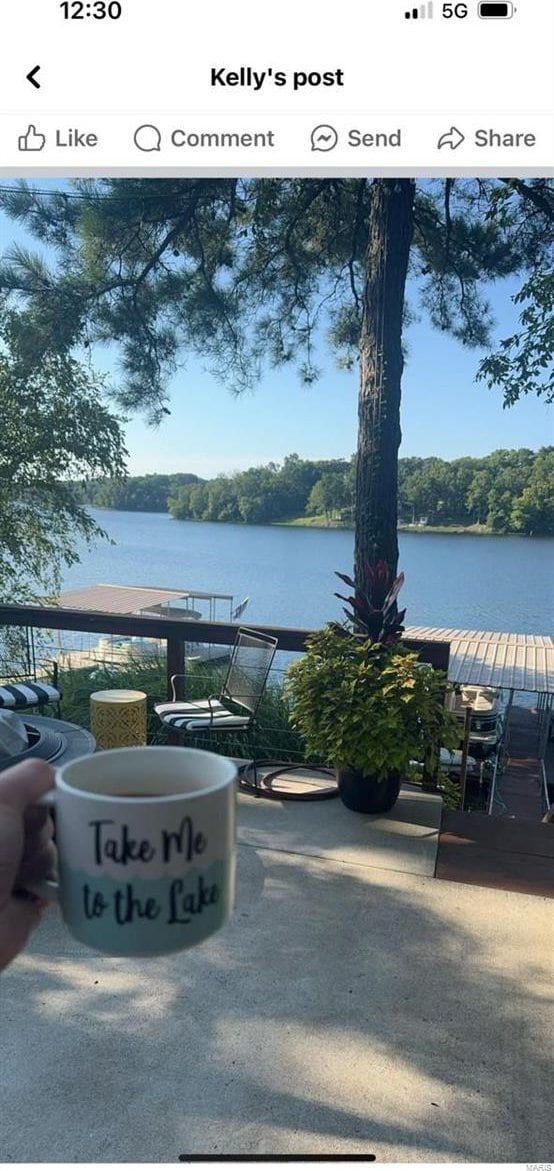 view of patio with a water view