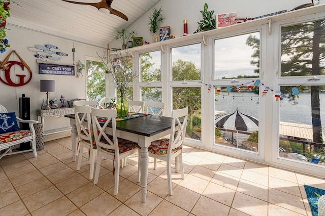 sunroom featuring a ceiling fan and vaulted ceiling