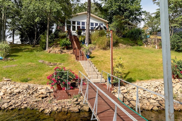 view of yard with stairs and a water view