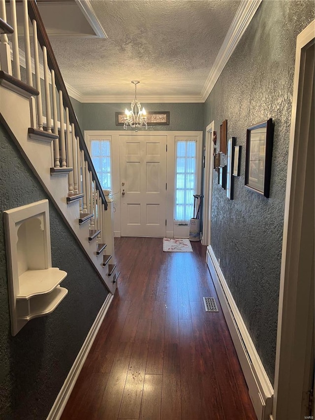 foyer with a baseboard radiator, crown molding, visible vents, and dark wood-type flooring