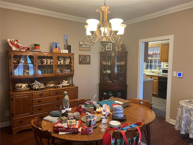 dining room with dark wood-style floors, baseboards, a chandelier, and crown molding