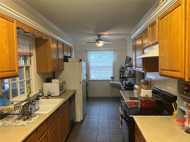 kitchen featuring white microwave, black range with electric cooktop, under cabinet range hood, a sink, and dishwasher