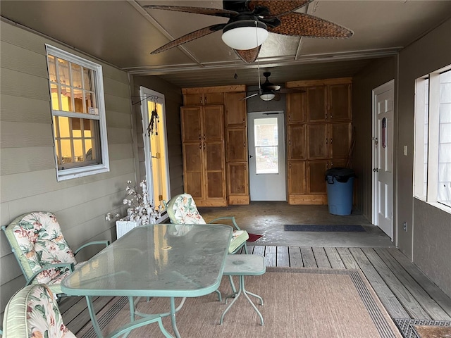 interior space with ceiling fan