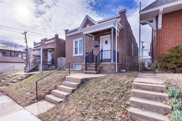 view of front of home featuring brick siding