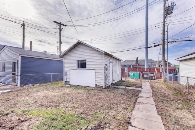 exterior space featuring an outdoor structure and a fenced backyard