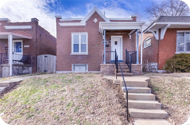 view of front of house featuring brick siding