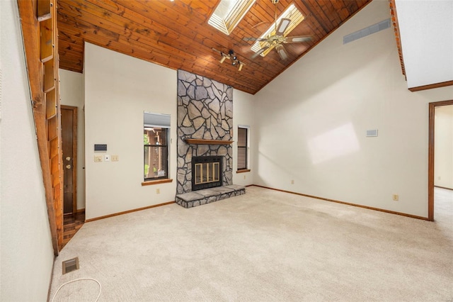 unfurnished living room featuring a fireplace, baseboards, ceiling fan, high vaulted ceiling, and carpet
