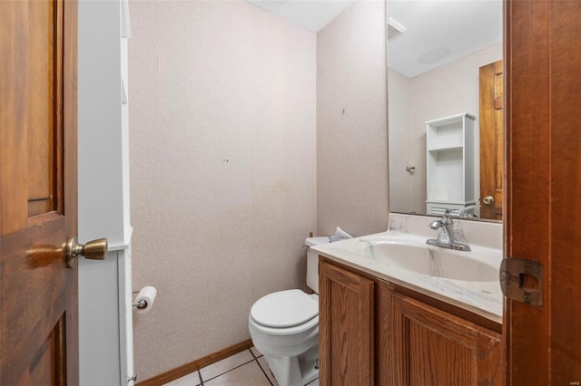 bathroom with vanity, tile patterned floors, and toilet