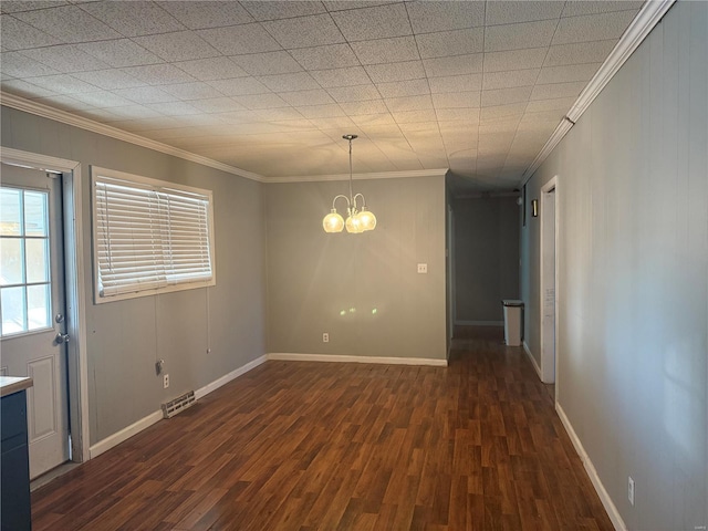 unfurnished dining area featuring visible vents, baseboards, dark wood-style flooring, crown molding, and a notable chandelier