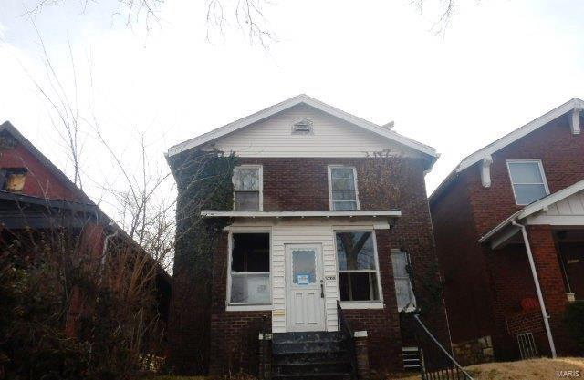 traditional home with entry steps and brick siding