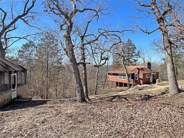 view of yard with a sunroom