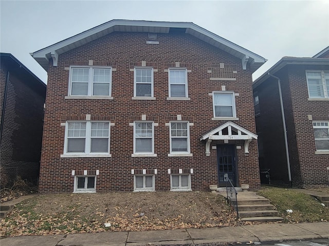 view of front of house featuring brick siding