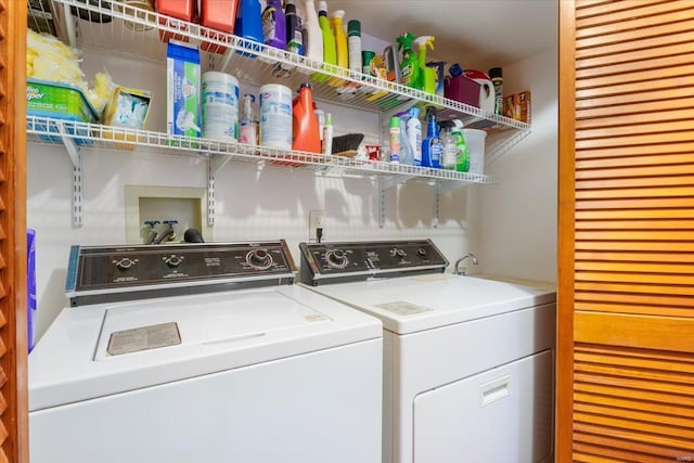 washroom featuring washer and dryer and laundry area