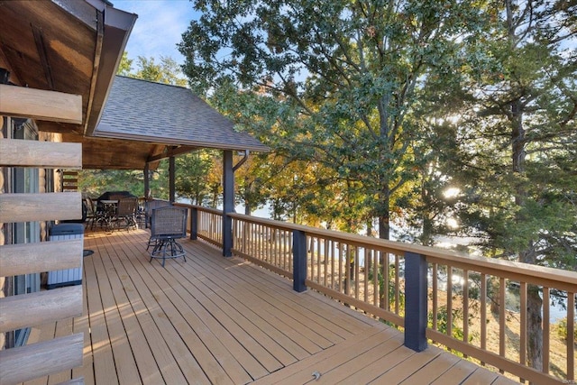 deck with outdoor dining area