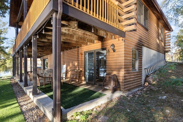 doorway to property with a patio area and a balcony