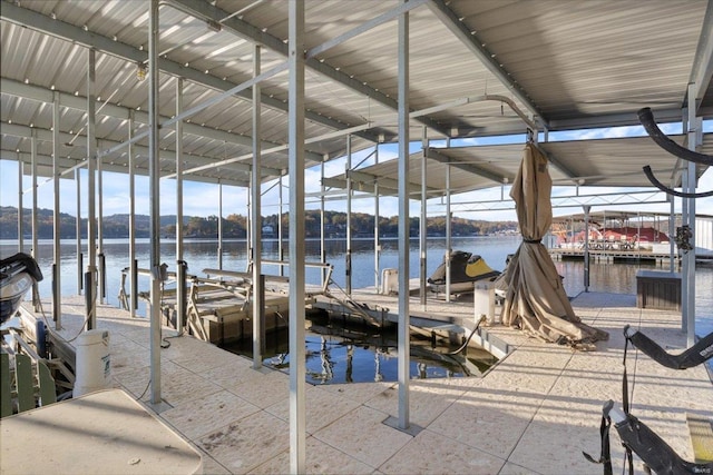 view of dock featuring a water view and boat lift