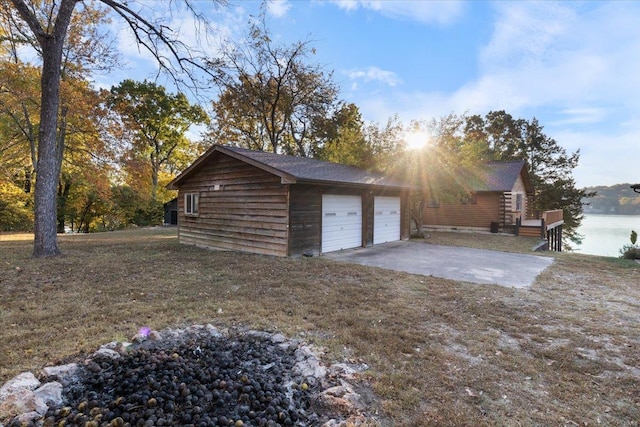 garage with concrete driveway