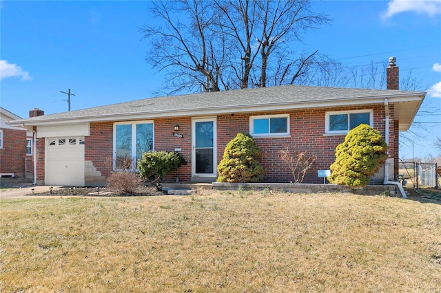 ranch-style house featuring an attached garage, brick siding, roof with shingles, a front lawn, and a chimney