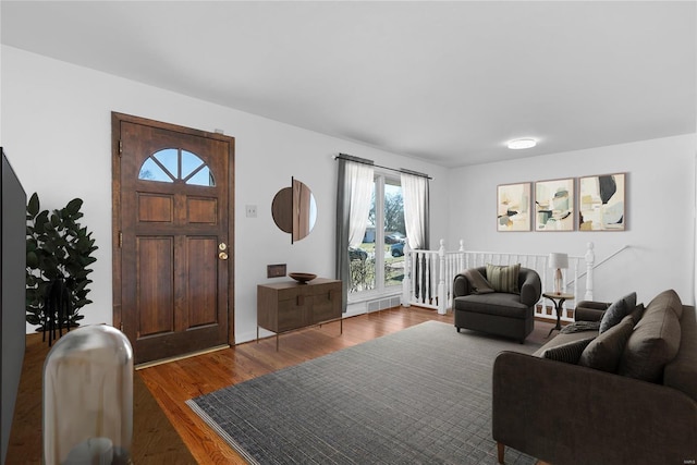 living room featuring visible vents and wood finished floors