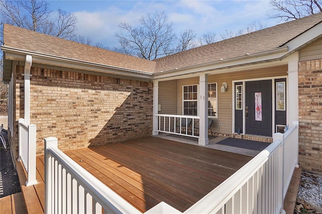 wooden terrace with a porch