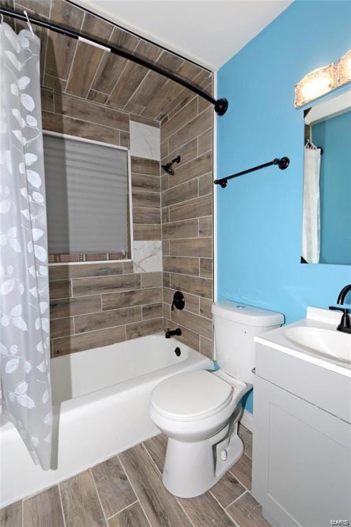 bathroom featuring vanity, wood finish floors, shower / bath combination with curtain, and toilet