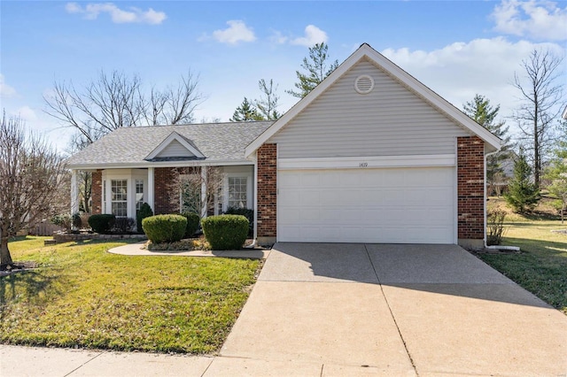 view of front of house with a garage, brick siding, concrete driveway, and a front lawn