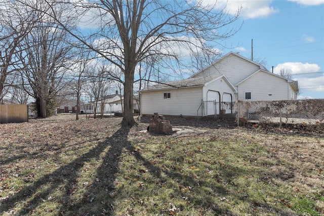 view of home's exterior featuring fence