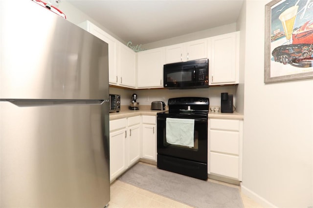 kitchen with white cabinets, light countertops, and black appliances