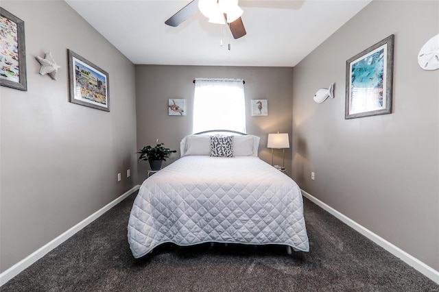 bedroom featuring a ceiling fan, dark colored carpet, and baseboards