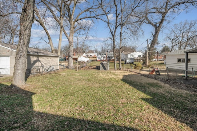 view of yard with an outdoor structure and fence