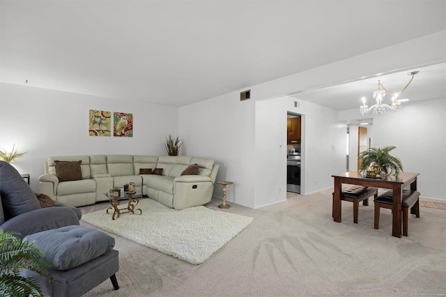 living area with light carpet, an inviting chandelier, and visible vents