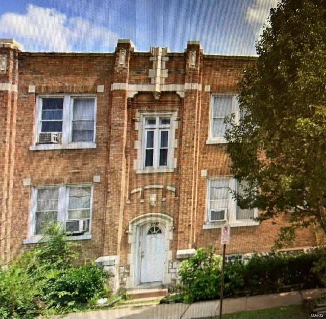 multi unit property featuring brick siding