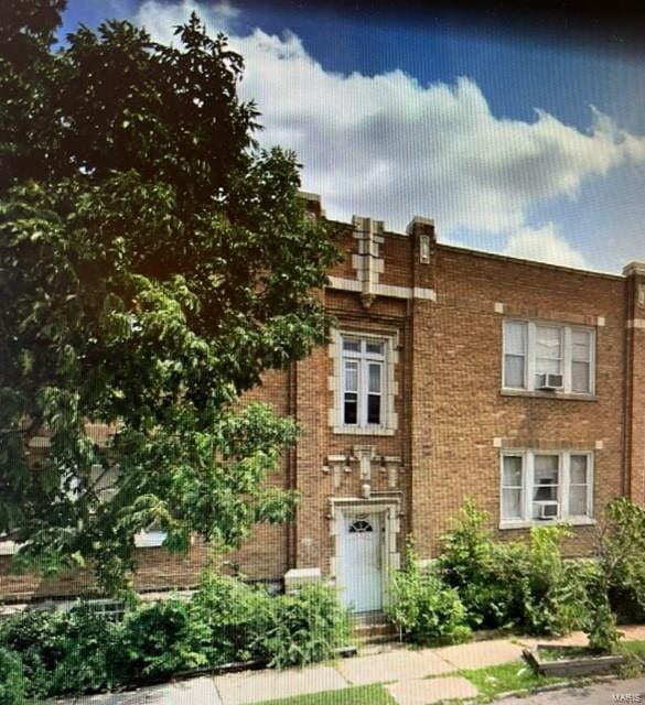 view of front of home featuring brick siding