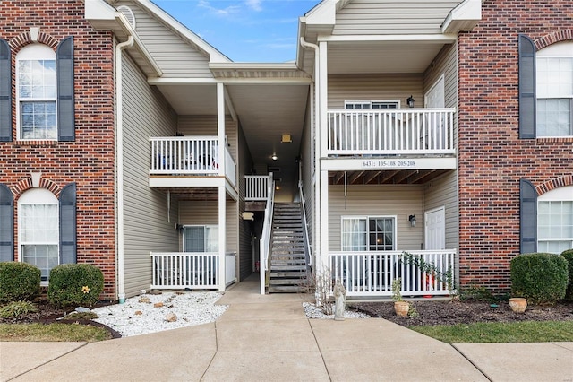 view of property featuring stairs