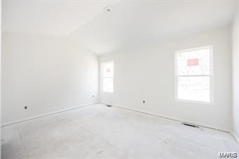 empty room with vaulted ceiling